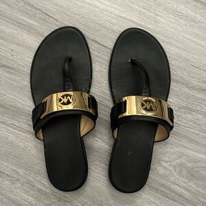 Black and gold Micheal Kors sandlas